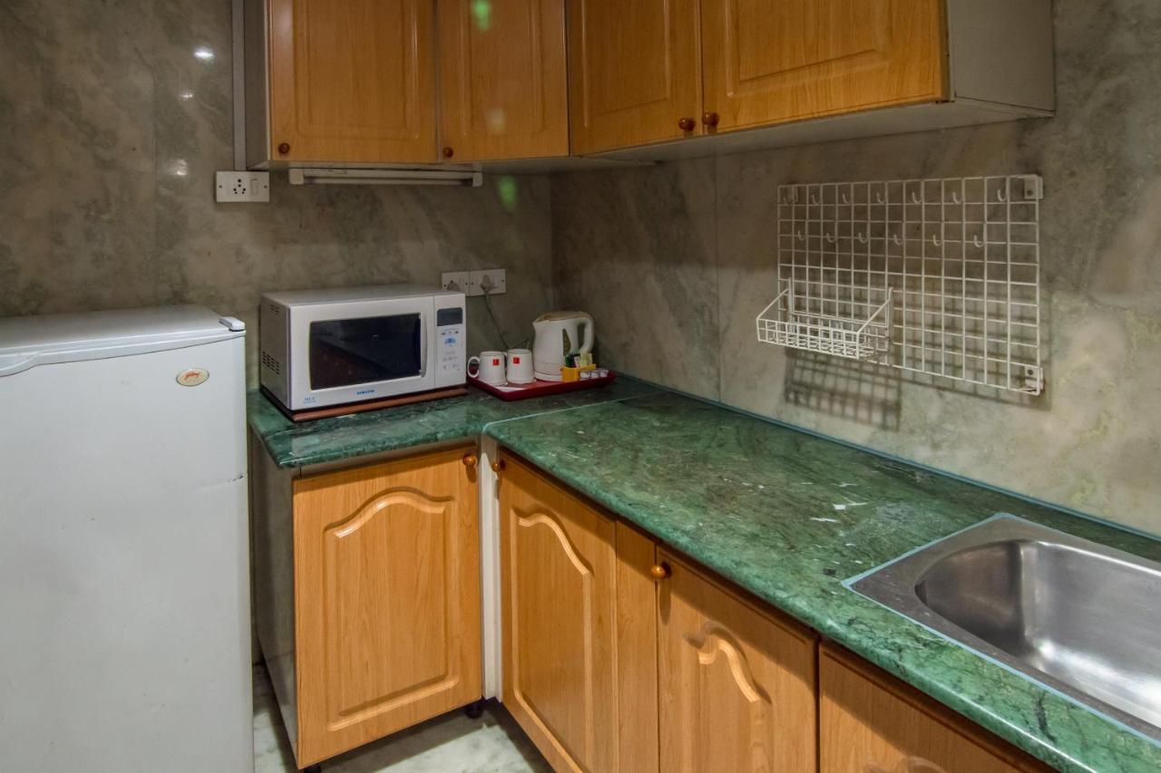 The Lalit Mumbai Hotel Kültér fotó A typical kitchen in a guest room at the hotel